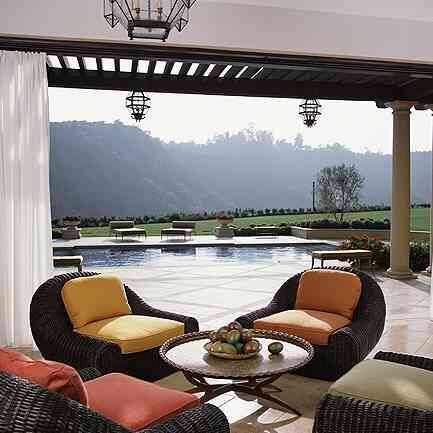 outdoor living space by luxurious pool created by adglighting.com